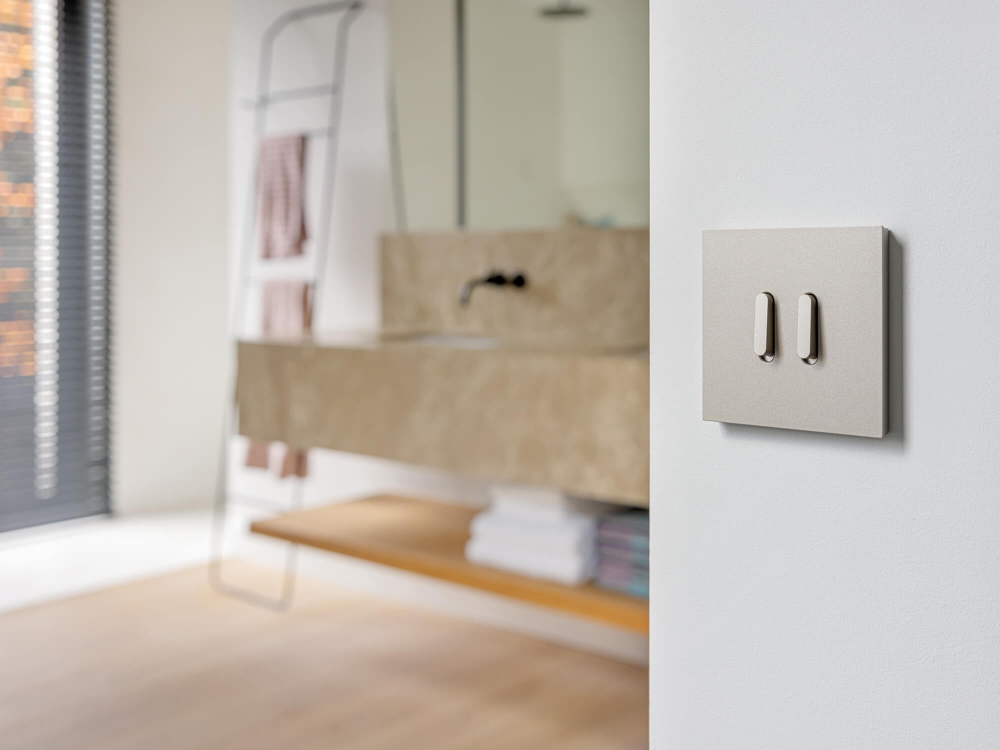 Niko Rocker - double light switch in colour steel champagne