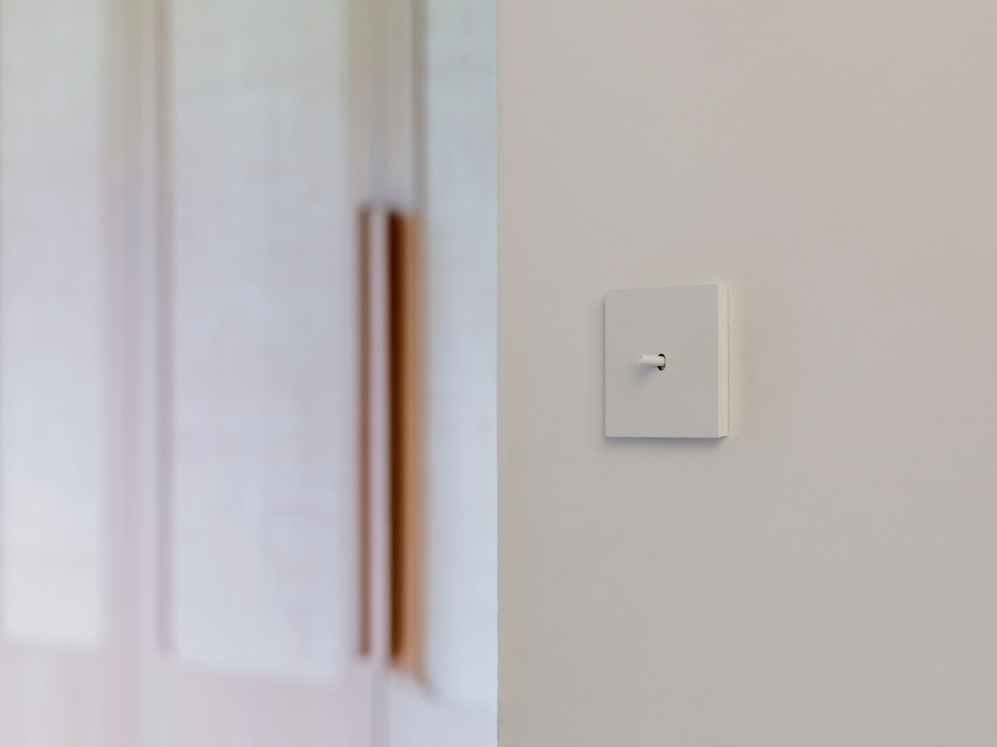 Niko Toggle witte design lichtschakelaar met feedback led