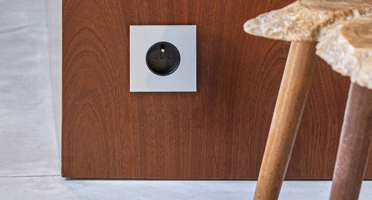 Design electrical socket silver coloured with black centre